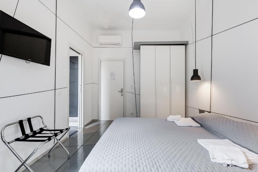 Posteľ alebo postele v izbe v ubytovaní The Upper Suites