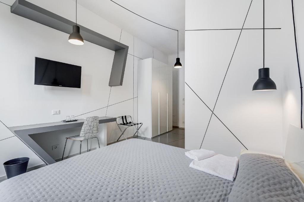 Posteľ alebo postele v izbe v ubytovaní The Upper Suites