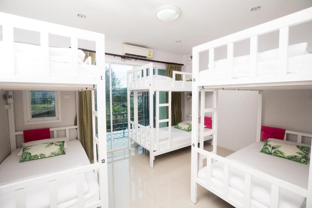 Postel nebo postele na pokoji v ubytování DKaYa Hostel