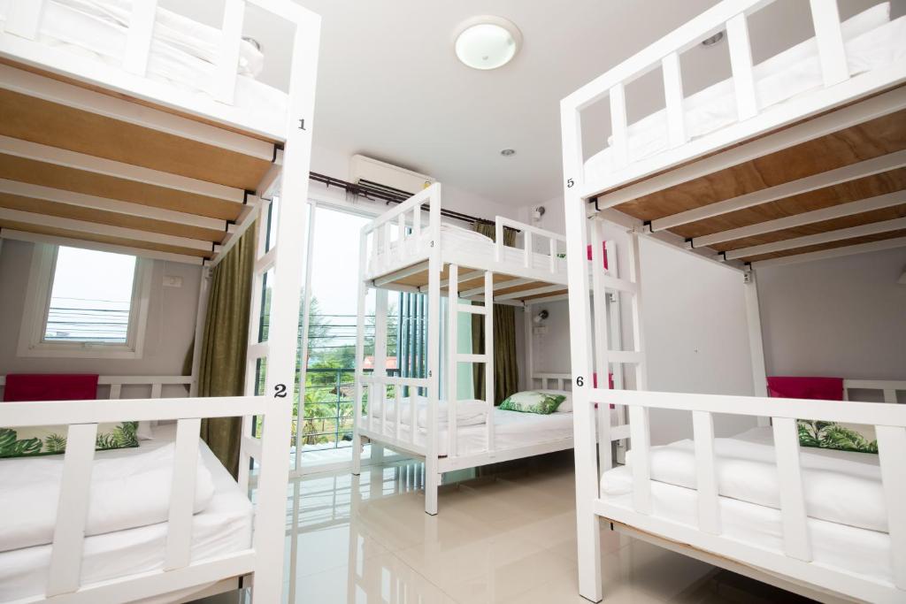Postel nebo postele na pokoji v ubytování DKaYa Hostel