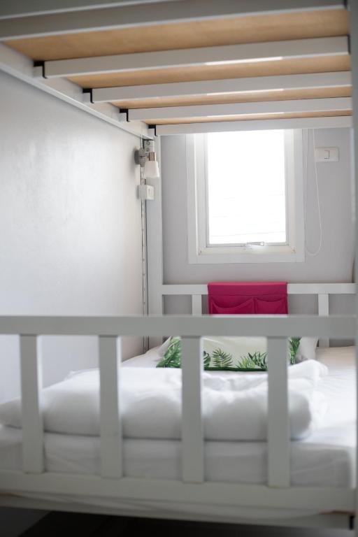 Postel nebo postele na pokoji v ubytování DKaYa Hostel