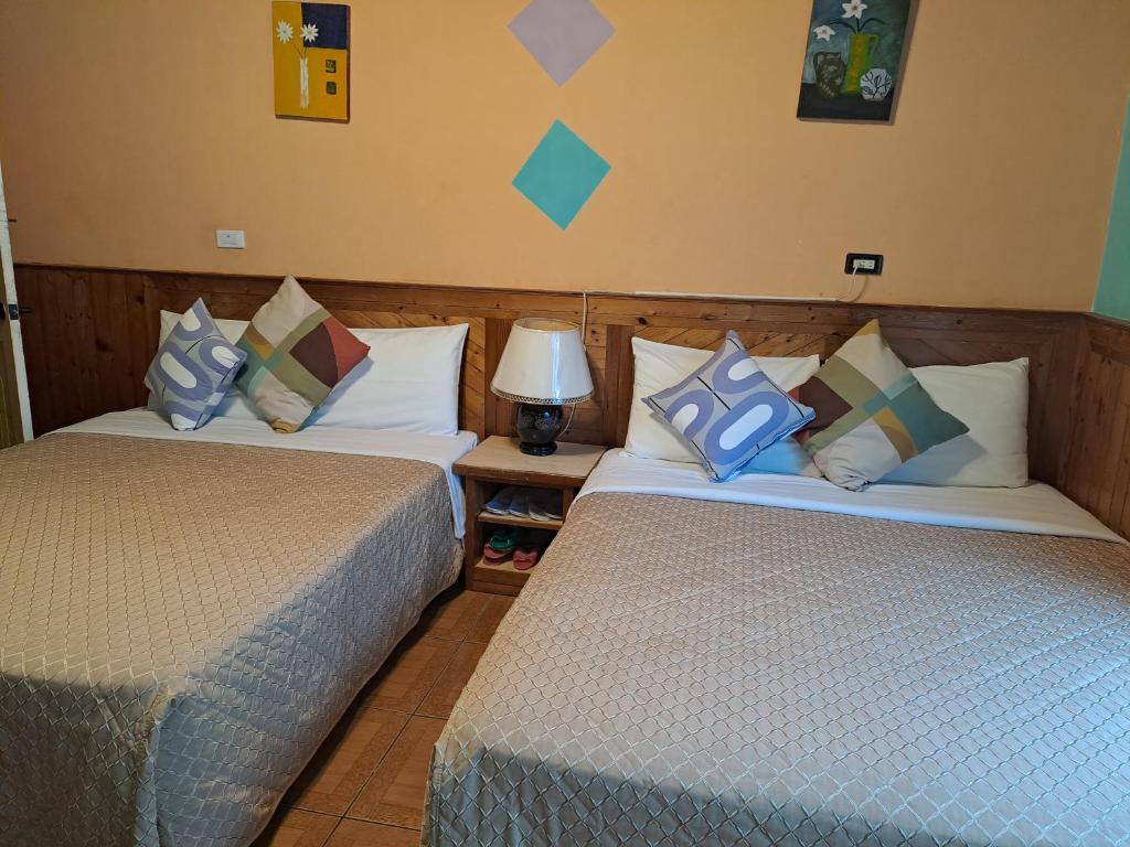 Postel nebo postele na pokoji v ubytování Heart Seed B&B