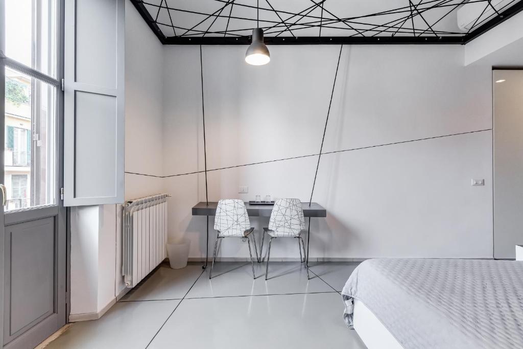 Posteľ alebo postele v izbe v ubytovaní The Upper Suites