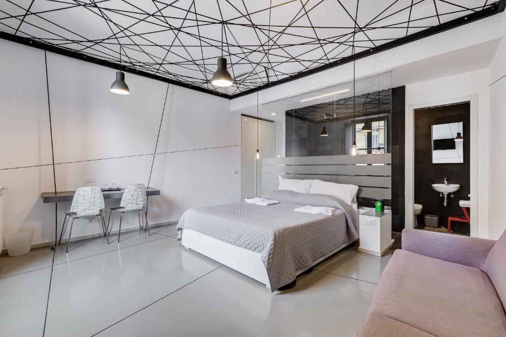 Posteľ alebo postele v izbe v ubytovaní The Upper Suites