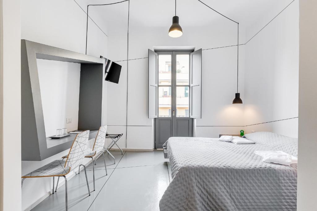 Posteľ alebo postele v izbe v ubytovaní The Upper Suites