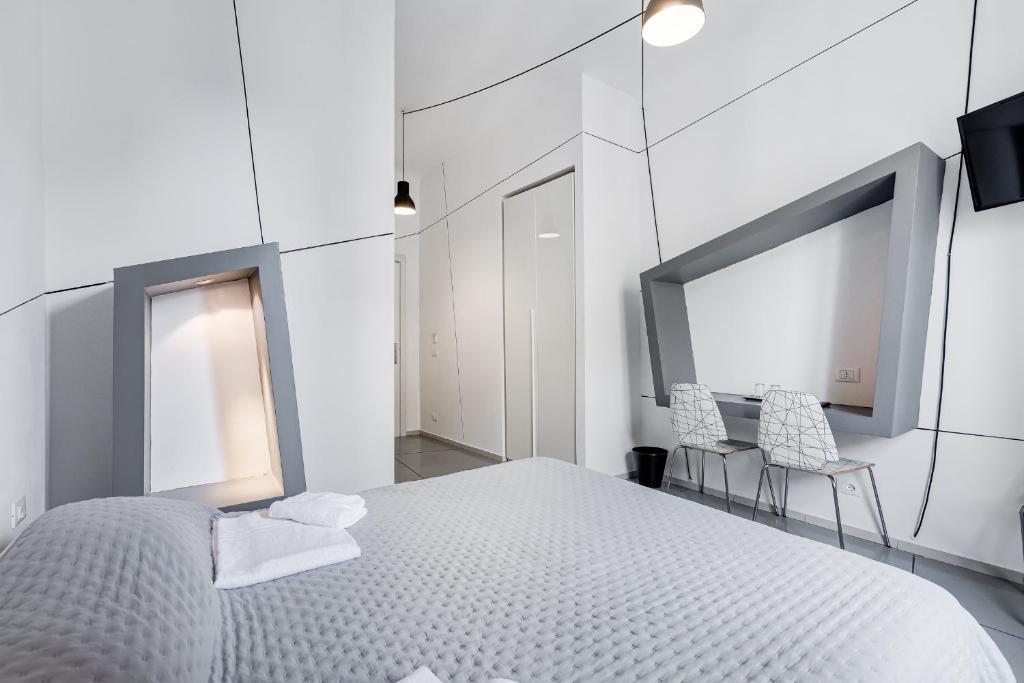 Posteľ alebo postele v izbe v ubytovaní The Upper Suites