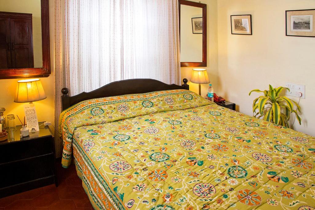 Postel nebo postele na pokoji v ubytování The Green Hotel