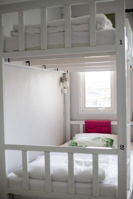 Postel nebo postele na pokoji v ubytování DKaYa Hostel