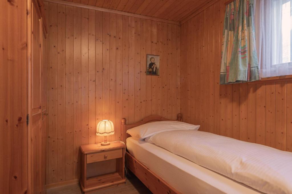 Posteľ alebo postele v izbe v ubytovaní Apartment Jungfrau Lodge