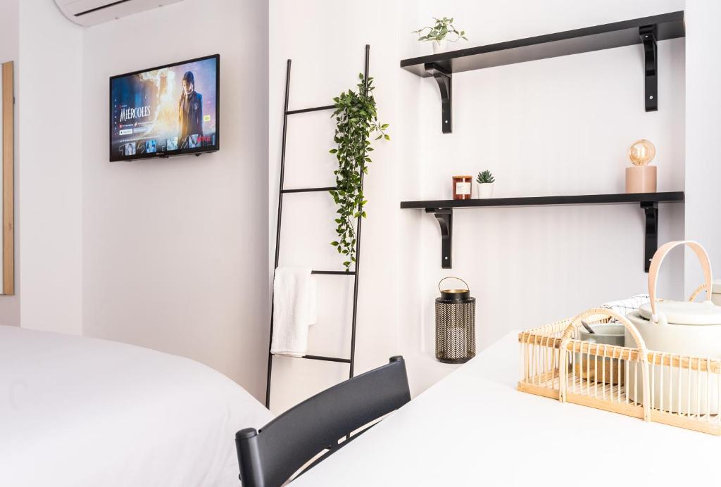 A bed or beds in a room at Nordik Rooms Urban - Centro "Helsinki"