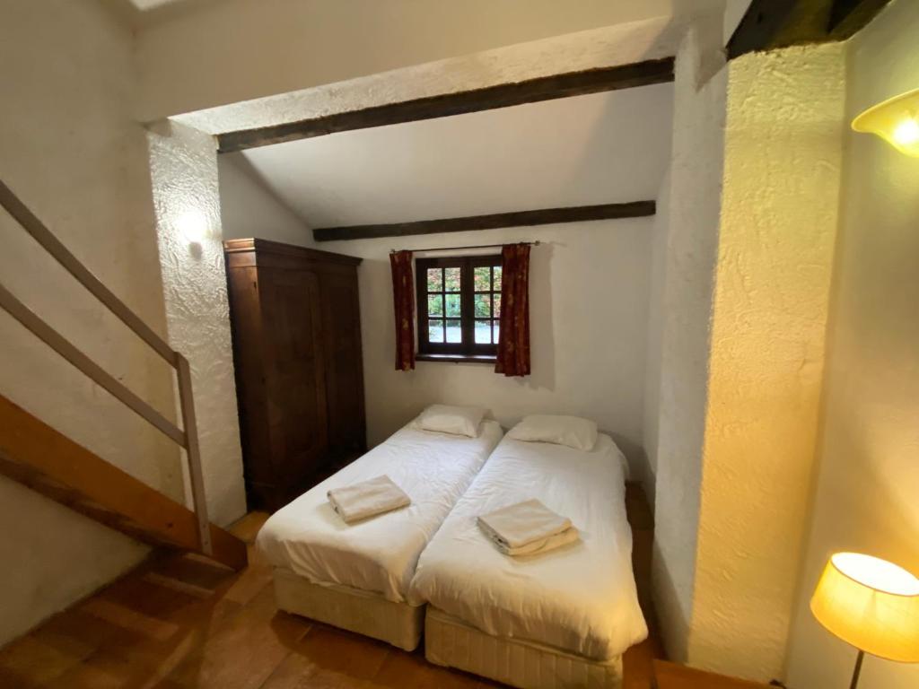 Posteľ alebo postele v izbe v ubytovaní Cosy former bakery house with communal swimming pool