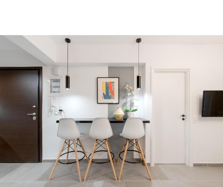 Televízia a/alebo spoločenská miestnosť v ubytovaní Iosifina Cosy Apartment
