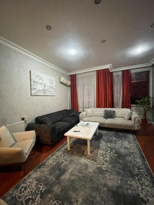 a living room with a couch and a table at Best Location on Taksim Square Big Flat 2+1 (140m2) in Istanbul