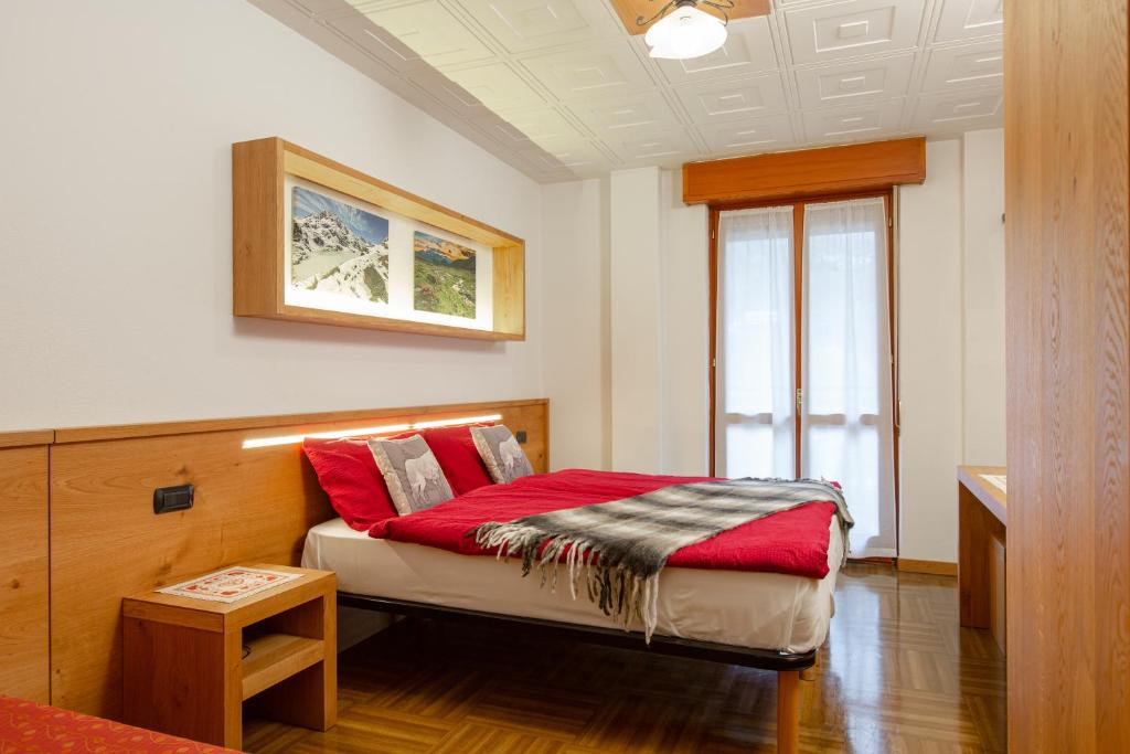 Postel nebo postele na pokoji v ubytování Hotel Biancospino