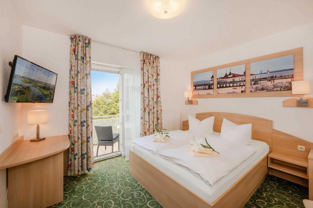 Postel nebo postele na pokoji v ubytování Gasthaus & Pension Natzke