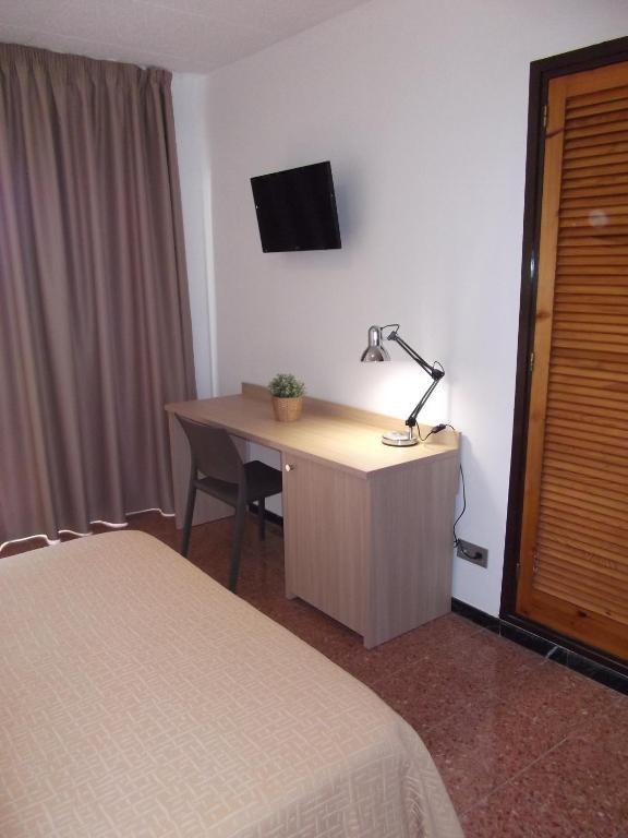 Postel nebo postele na pokoji v ubytování Hotel Mediterrani Express