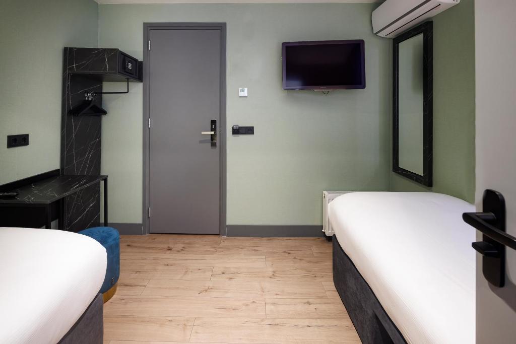 Postel nebo postele na pokoji v ubytování Ciao Papa Hotel Amsterdam Central Station