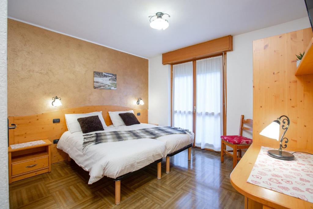 Postel nebo postele na pokoji v ubytování Hotel Biancospino