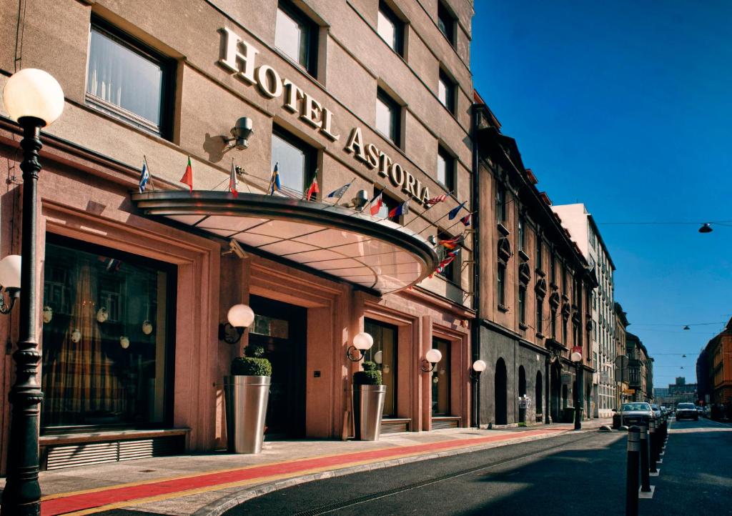a building with a sign for a hotel on a street at Best Western Premier Hotel Astoria in Zagreb
