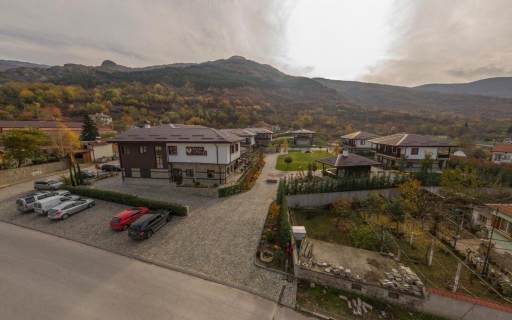 an aerial view of a house with cars parked in a driveway at Complex YustinaVillas in Ustina