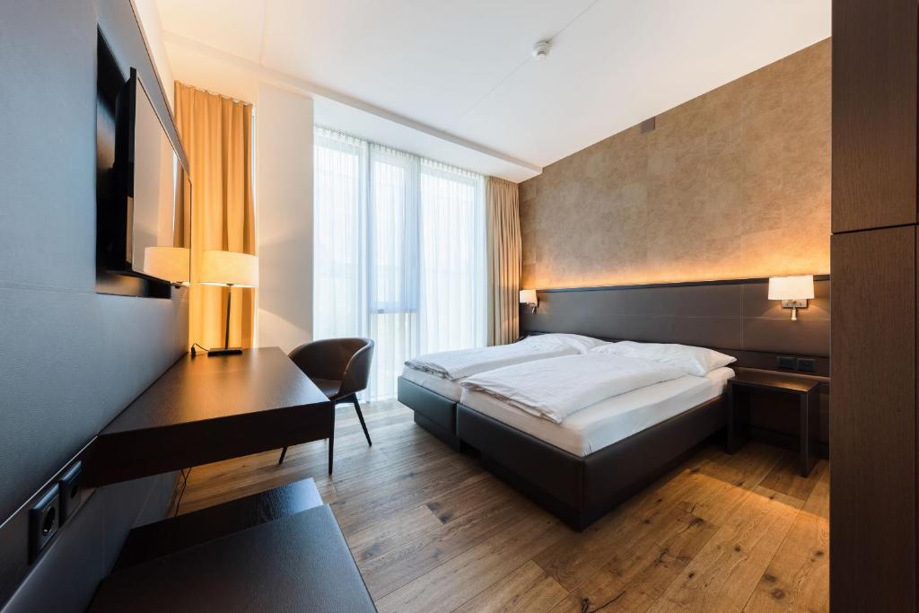 Postel nebo postele na pokoji v ubytování Hotel kommod