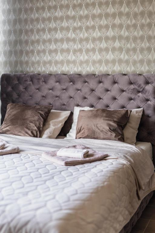 Una cama o camas en una habitación de Apartman Ambijent Divcibare