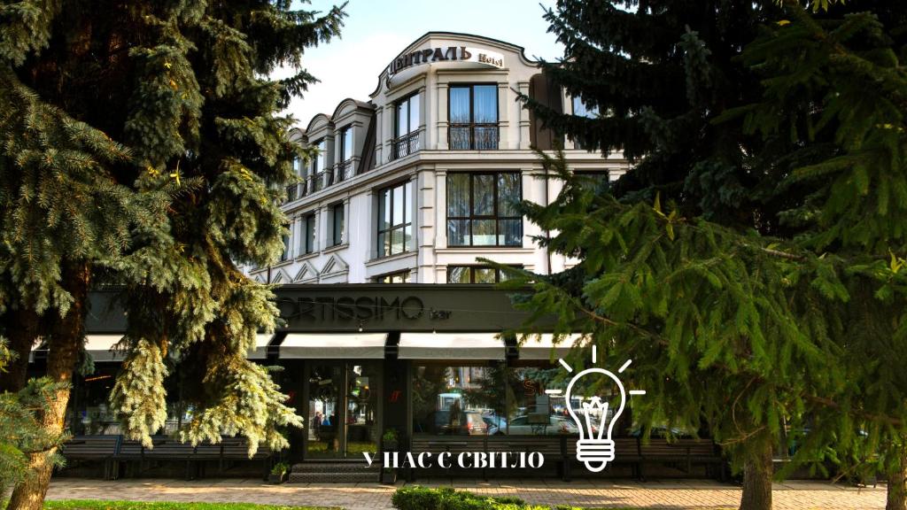 a building with a light on the front of it at Boutique Hotel Central in Rivne