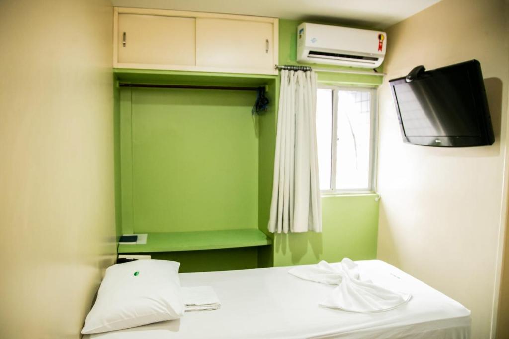 Cama ou camas em um quarto em Cidade Verde Flat Hotel