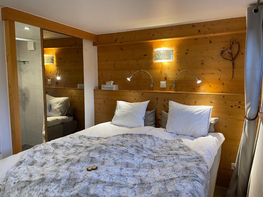 Postel nebo postele na pokoji v ubytování Chalet Rayon de Soleil Gryon Villars