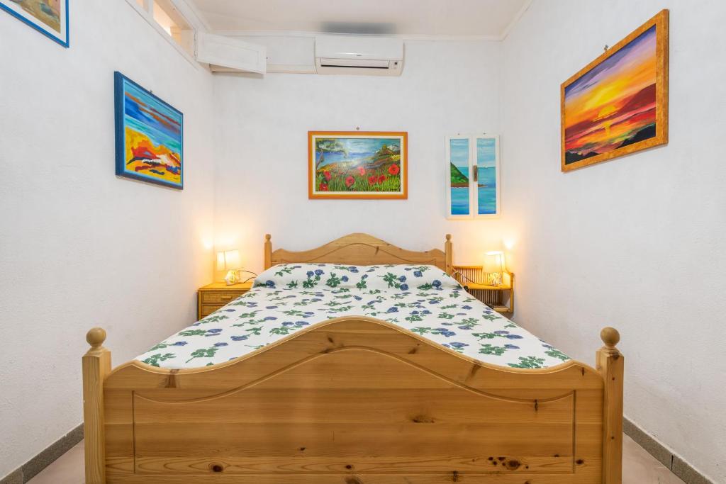 Postel nebo postele na pokoji v ubytování Casa San Fruttuoso