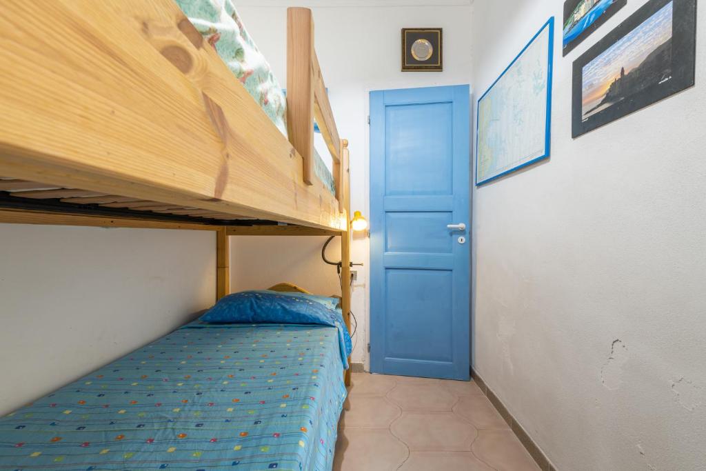Postel nebo postele na pokoji v ubytování Casa San Fruttuoso