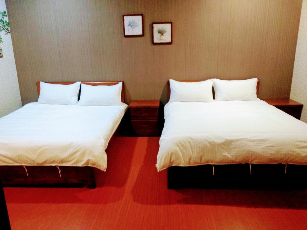 Postel nebo postele na pokoji v ubytování Ju Jia Xiao Zhan Homestay