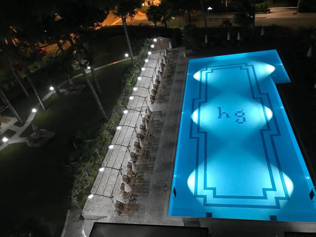 an overhead view of a clock tower at night at Hotel Greif in Lignano Sabbiadoro