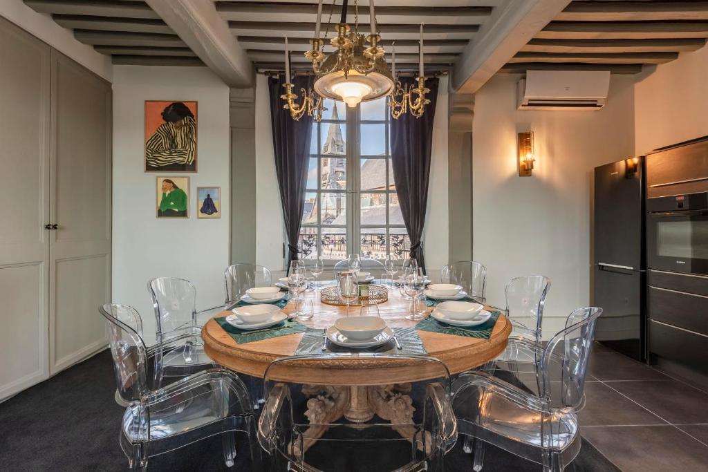 a dining room with a table and chairs at La Demeure du Clocher 4 - On the Port and Place St Catherine - 8 P in Honfleur