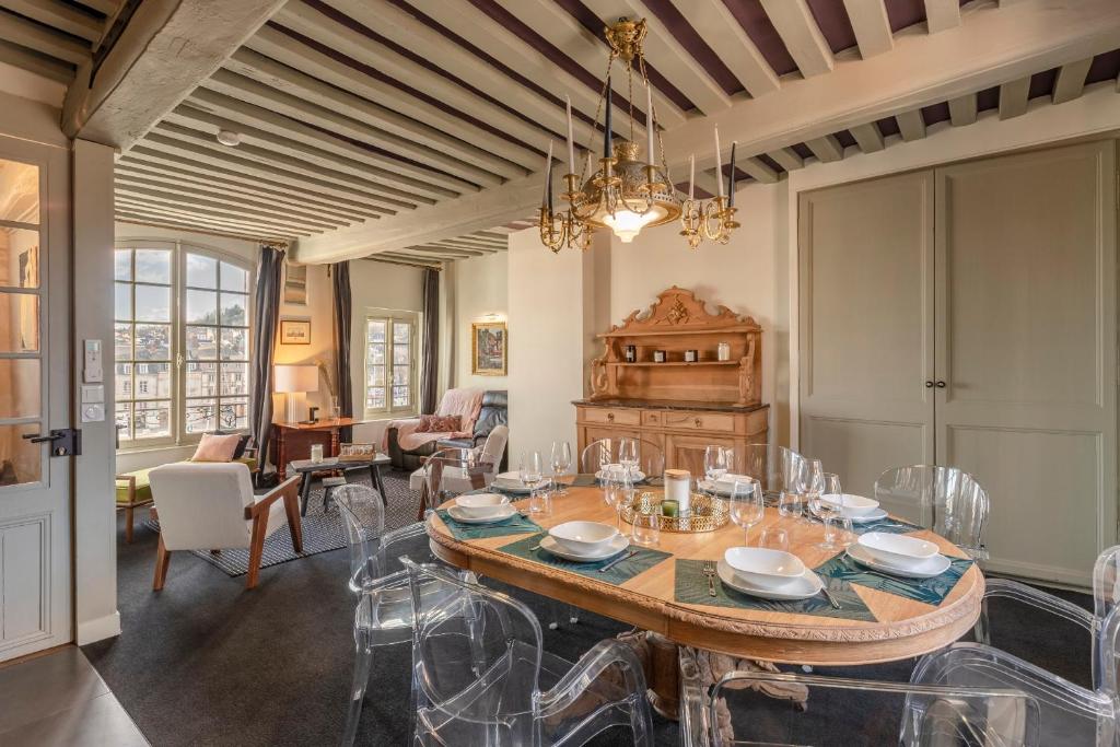 a dining room with a table and chairs at La Demeure du Clocher 4 - On the Port and Place St Catherine - 8 P in Honfleur
