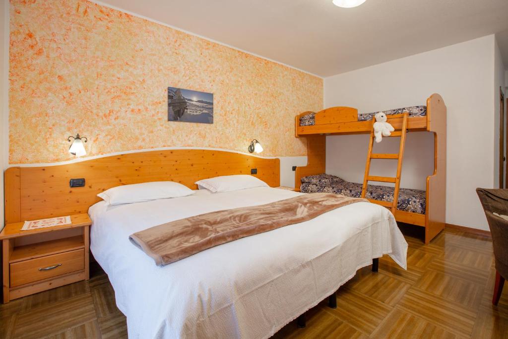Postel nebo postele na pokoji v ubytování Hotel Biancospino