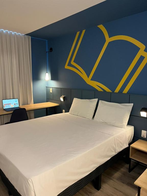 Postel nebo postele na pokoji v ubytování ibis Styles Poços de Caldas