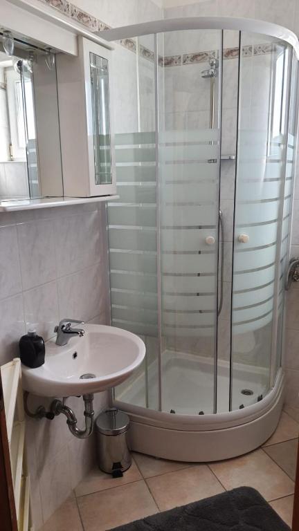 a bathroom with a shower and a sink at Apartments Irena in Božava
