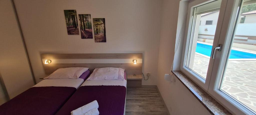 Posteľ alebo postele v izbe v ubytovaní Amna Home