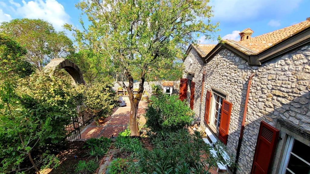 A garden outside Heritage mountain top Villa near Rome w/ Pool & Panoramic views