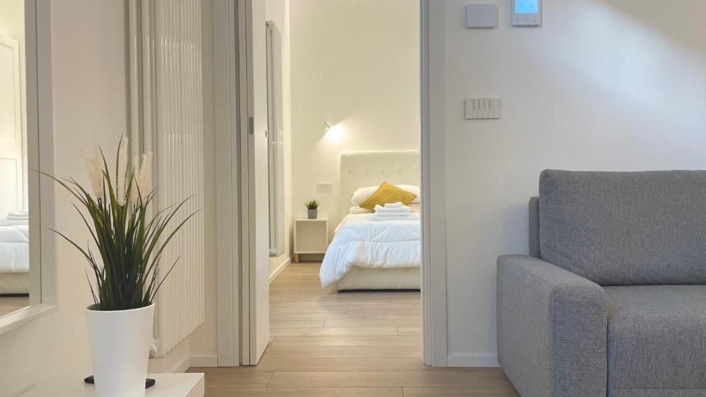 Postel nebo postele na pokoji v ubytování Casa Manzoni Deluxe MXP Town Center
