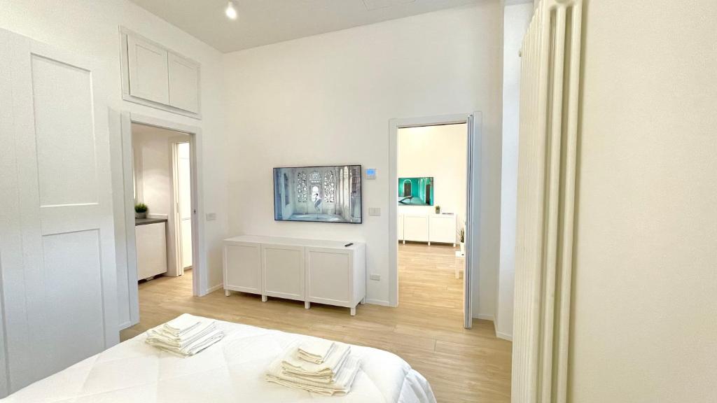 Postel nebo postele na pokoji v ubytování Casa Manzoni Deluxe MXP Town Center