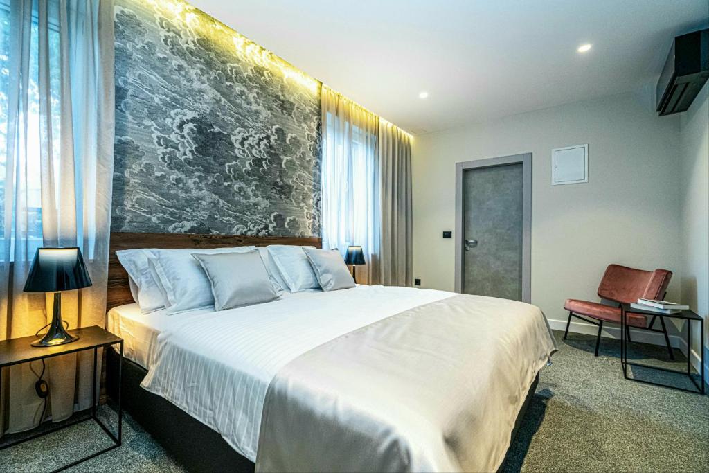 Postel nebo postele na pokoji v ubytování Calma Luxury Rooms