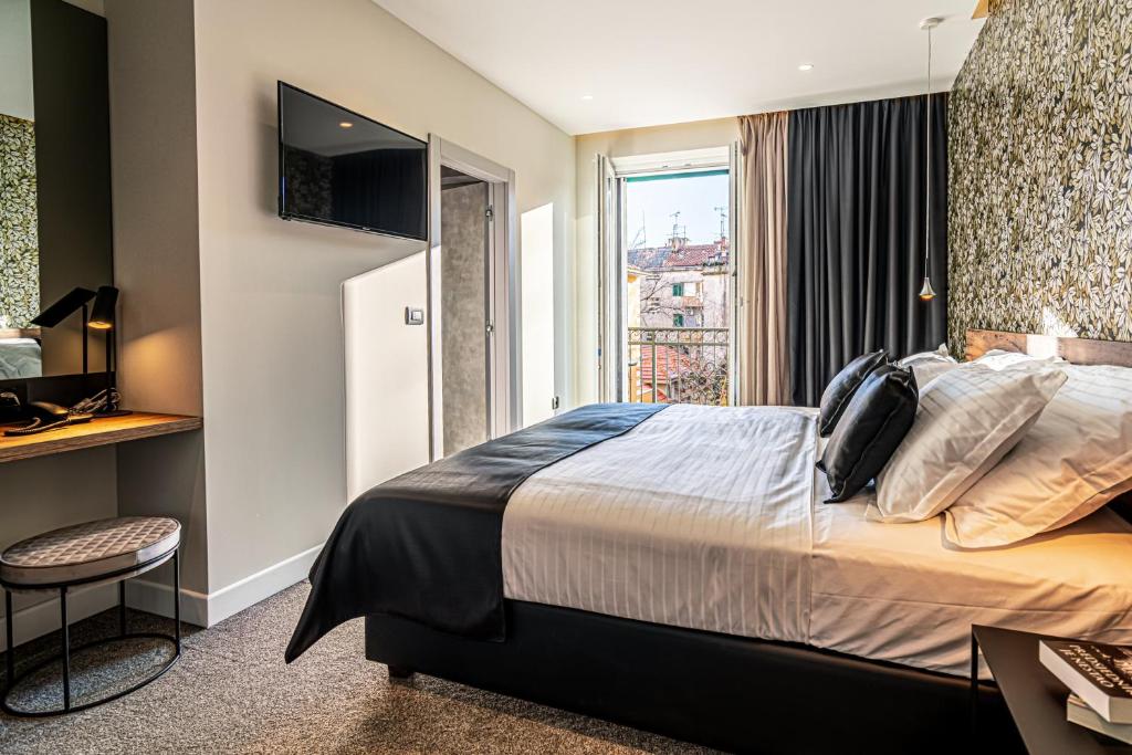 Postel nebo postele na pokoji v ubytování Calma Luxury Rooms