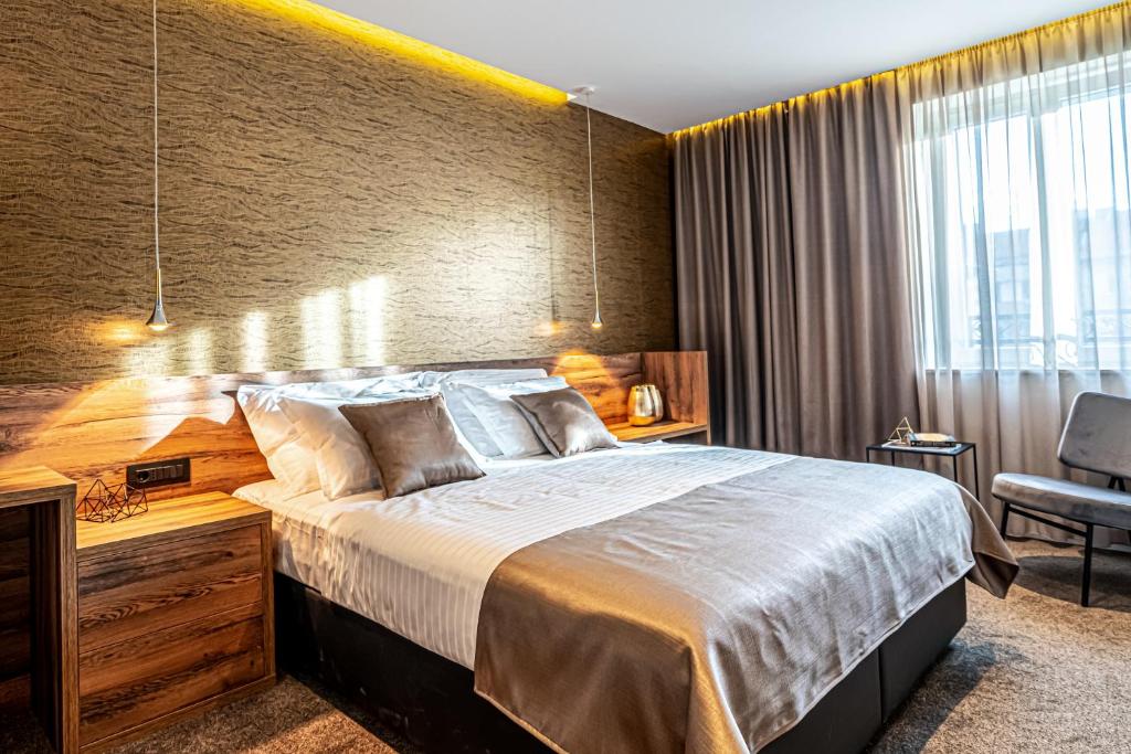 Postel nebo postele na pokoji v ubytování Calma Luxury Rooms