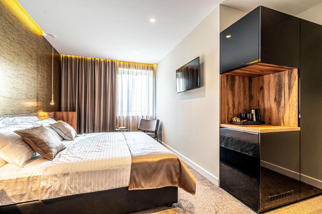 Postel nebo postele na pokoji v ubytování Calma Luxury Rooms