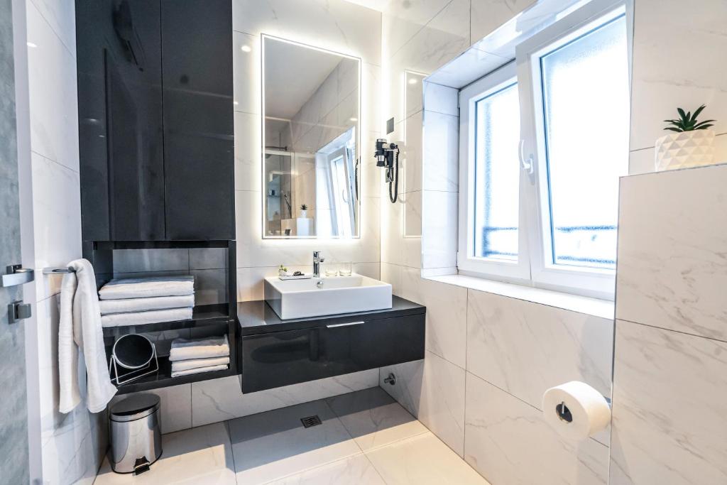 Koupelna v ubytování Calma Luxury Rooms