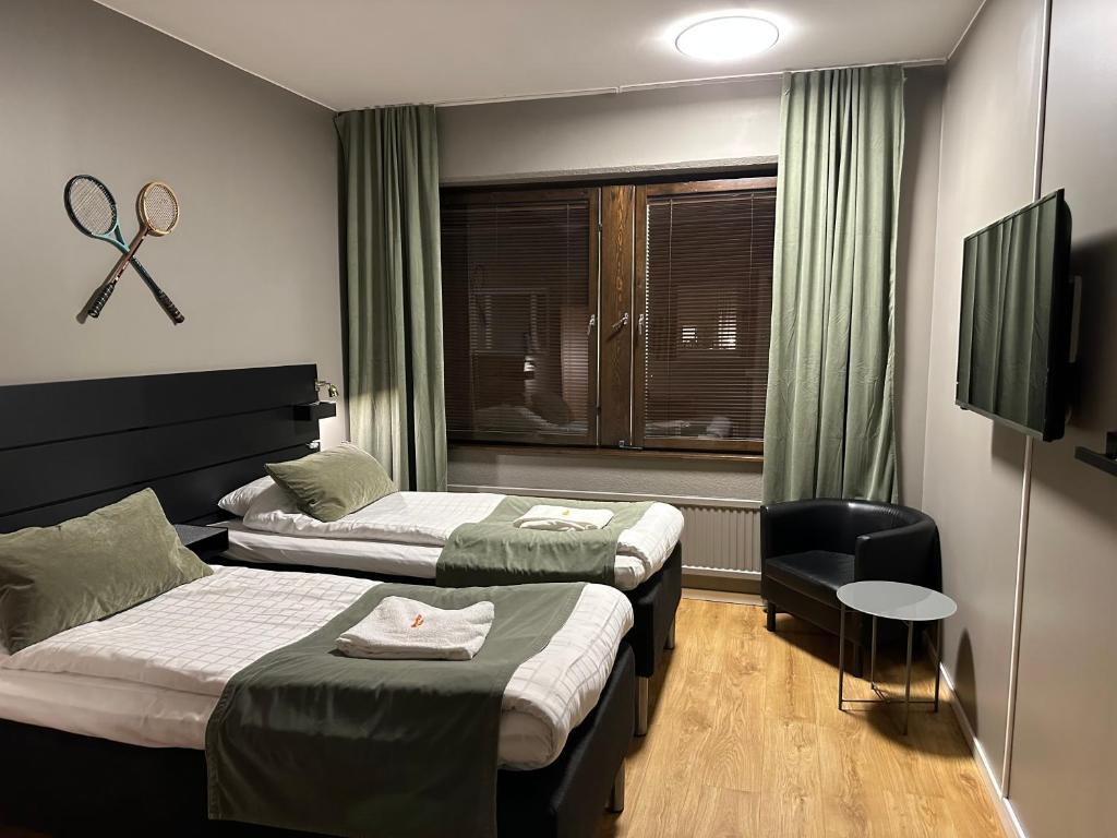 Postel nebo postele na pokoji v ubytování Hotel B&B Gränden