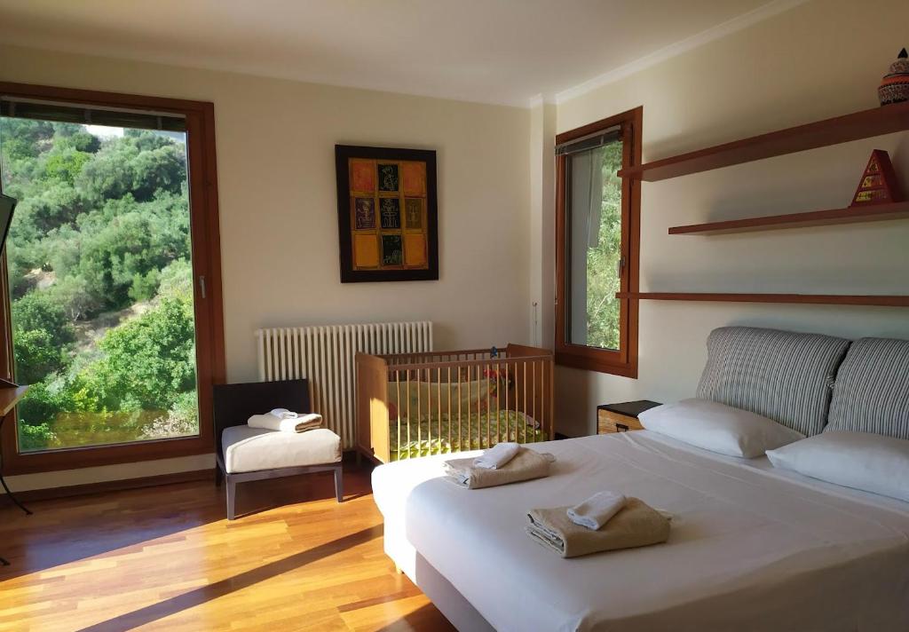 Postel nebo postele na pokoji v ubytování Villa Orgoni