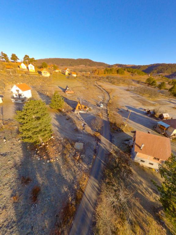 an overhead view of a road in a field at A Pine vikendica u srcu Zapadne Srbije in Nova Varoš